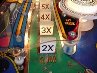Image # 9008: Eight Ball Deluxe Playfield Detail 
(Notice the white pop bumper cap. This game has serial number EBD 1394.)