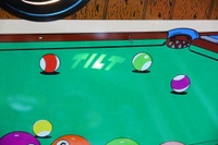 Image # 47762: "8 Ball" Backglass - Tilt Light 
(Serial number 52250.)