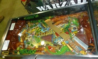 Image # 49185: Escape from the Lost World Playfield 
(The playfield glass shows the artwork applied to its underside.)