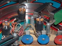 Image # 54050: F-14 Tomcat Early Production - Flash Lamp Insulators 
(Serial number 554 95836. The green spinning target has relatively little wear for the age of this game and is deemed a replacement. The red target on the right likely replaced an original blue one.)