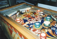 Image # 6541: Falstaff Playfield,Showing Cardholder Lamps 
(Illuminated lamps under the cardholder shine onto the playfield as an earned feature. Serial number D65761F.)