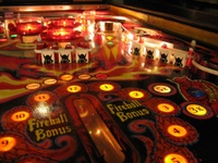 Image # 40268: Fireball II Illuminated Upper Right Playfield 
(The factory mylar has been removed from this playfield. The drop targets and bumper caps are after-factory manufacture using Bally's original dies.)