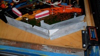 Image # 49151: Flight 2000 Ball Serve Solenoid Below Playfield 
(Serial number 6324. Playfield edge has no date.)