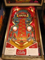 Image # 45689: Flip Flop Prototype Game - Illuminated Playfield 
(The mushroom bumpers were originally white but were replaced with yellow ones by a collector.)
