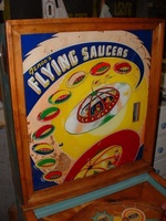 Image # 58732: Flying Saucers Backglass 
(The rectangular window on the right side of the backglass allows the player to view a pendulum tilt.)