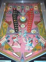 Image # 9147: 4 Aces Playfield 
(Note that this playfield shows a pop bumper where the flyer shows a spinner in the center of the playfield.)