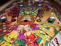 Image # 64602: 4 Roses Playfield 
(This playfield is original condition. Only the rubbers, bulbs, bulb sockets, and bumper skirts have been replaced.)