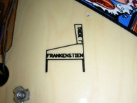 Image # 38100: Mary Shelley's Frankenstein Playfield - Detail 
(This art element is located on lower playfield under the apron. Notice the misspelling.)