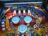 Image # 29645: Frontier Upper Playfield 
(The center stand-up target shown here (below the bottom pop bumper) is not original to this game.)