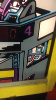 Image # 74359: Gamatron Backglass - Artist Signature 
(Artist Seamus McLaughlin signed with his initials.)